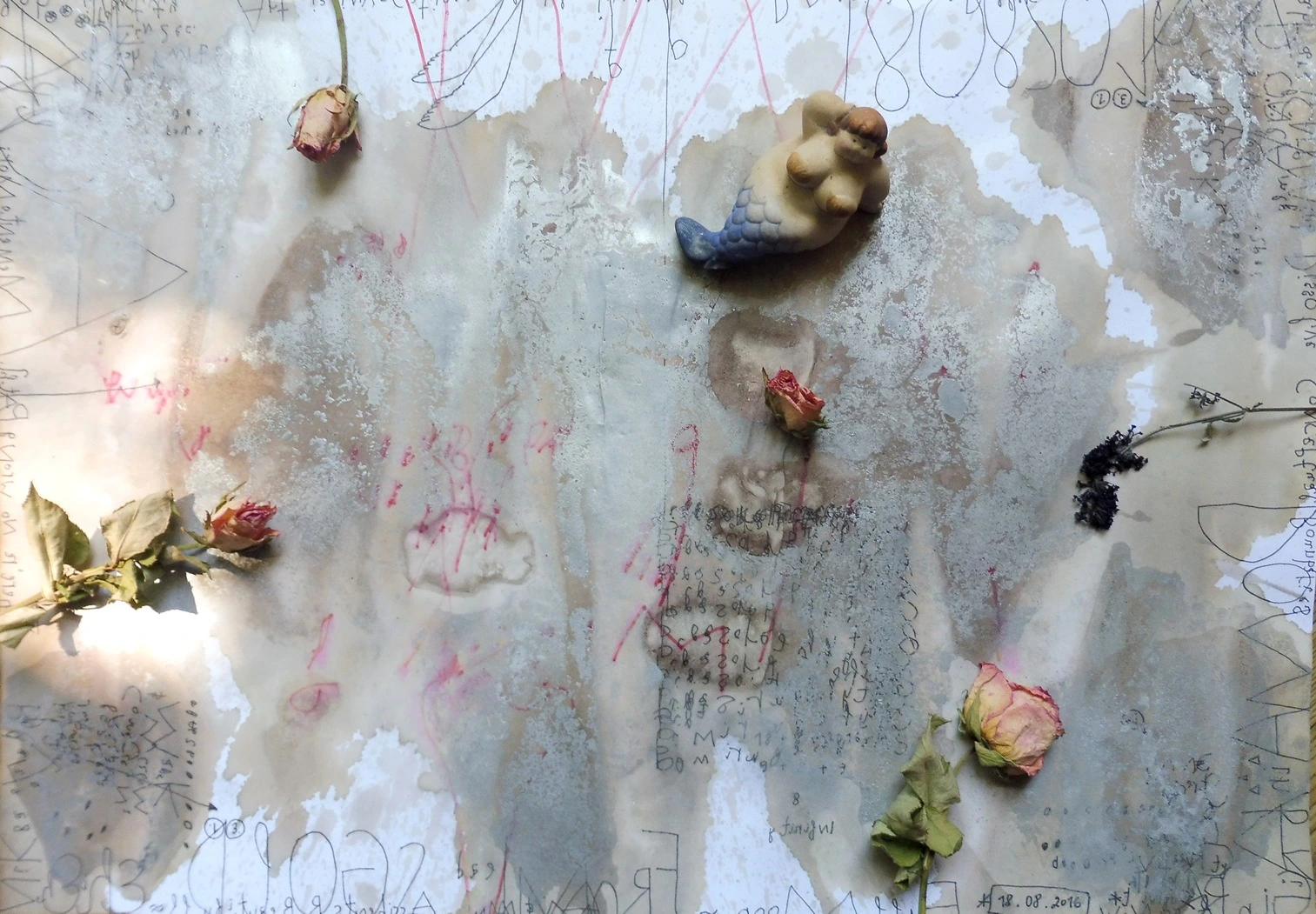 Small objects across a pale translucent surface