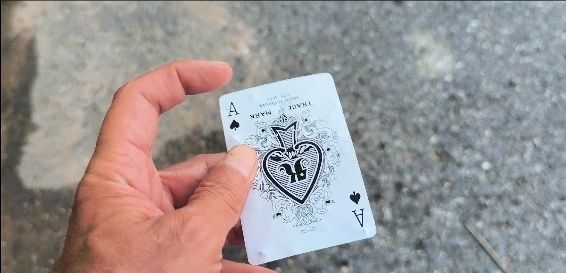Discovery 04: A♠, documented beside the road in Kep